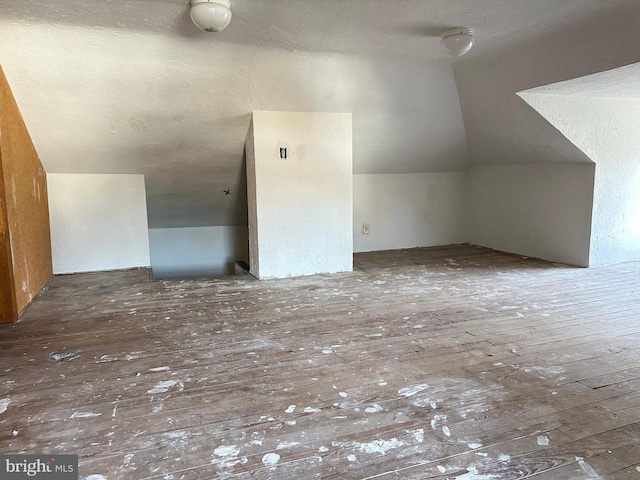 bonus room featuring lofted ceiling