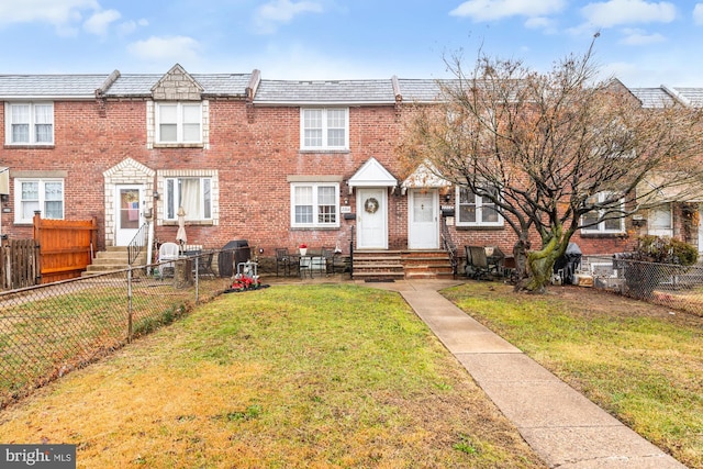 view of property featuring a front yard