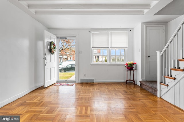 foyer featuring radiator heating unit and light parquet flooring