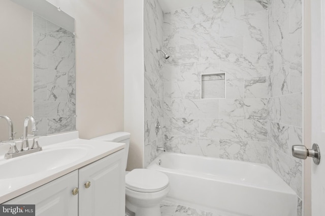 full bathroom with tiled shower / bath combo, toilet, and vanity