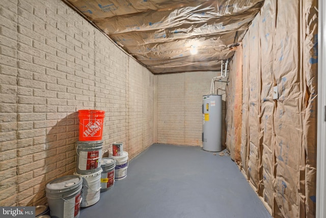 basement with brick wall and water heater