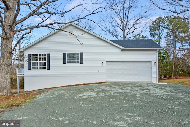 view of side of home featuring a garage