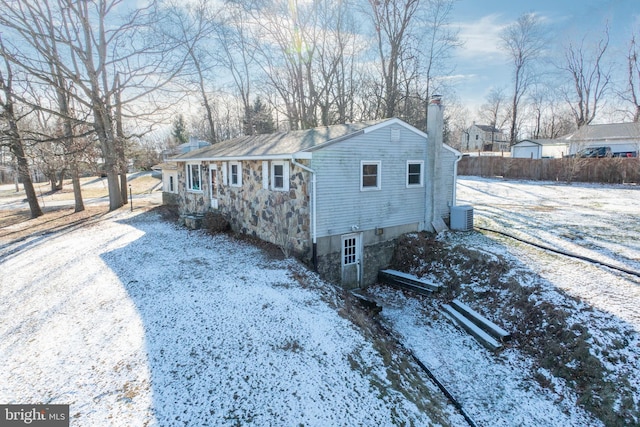 view of front of home featuring central air condition unit