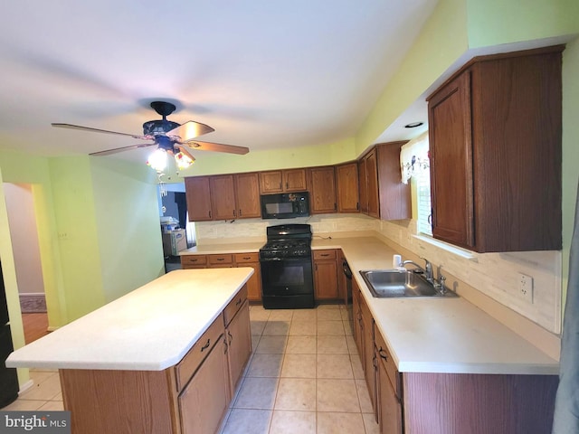 kitchen with sink, light tile patterned floors, a center island, tasteful backsplash, and black appliances