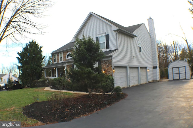 view of property exterior featuring a garage, a yard, and a shed