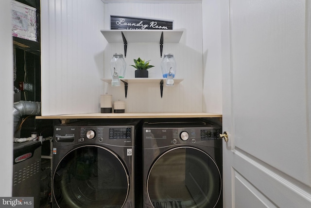 clothes washing area featuring washer and dryer