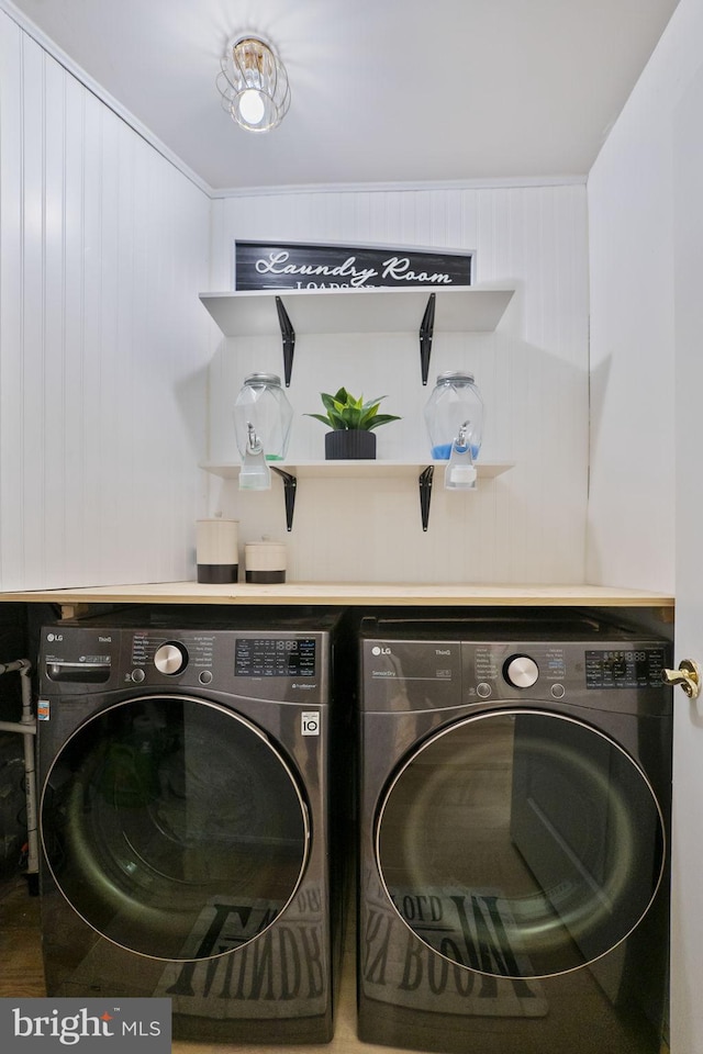 washroom featuring washer and dryer