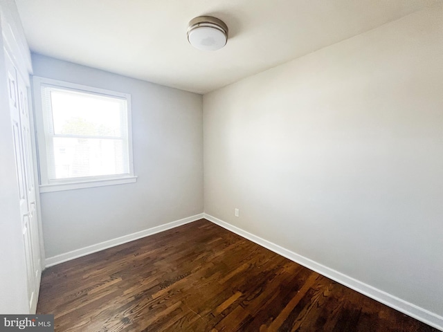 empty room featuring dark hardwood / wood-style floors