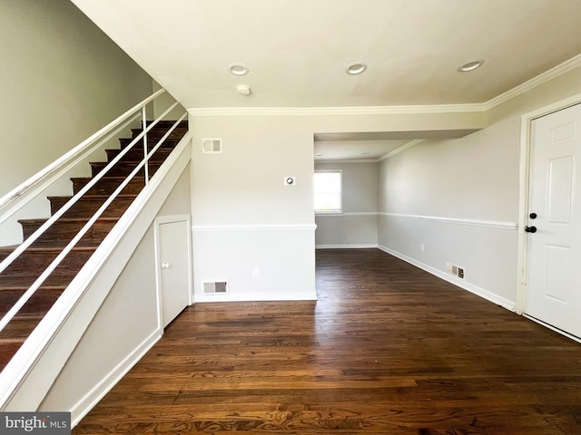 interior space with crown molding and dark wood-type flooring