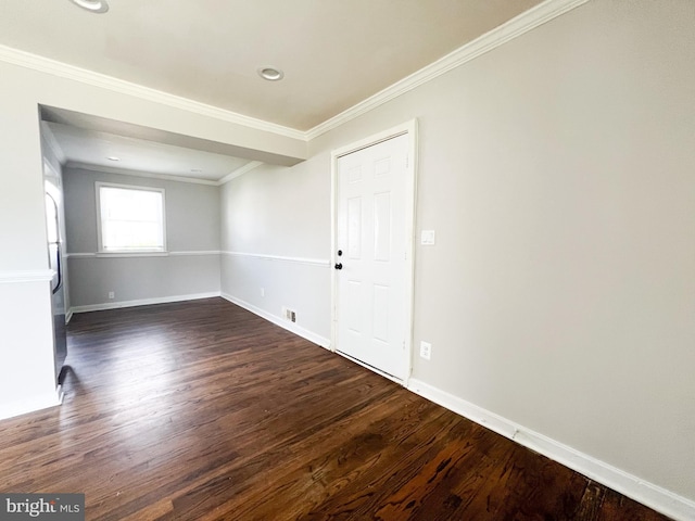 unfurnished room featuring crown molding and dark hardwood / wood-style flooring