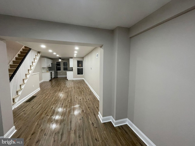 unfurnished living room featuring dark hardwood / wood-style flooring