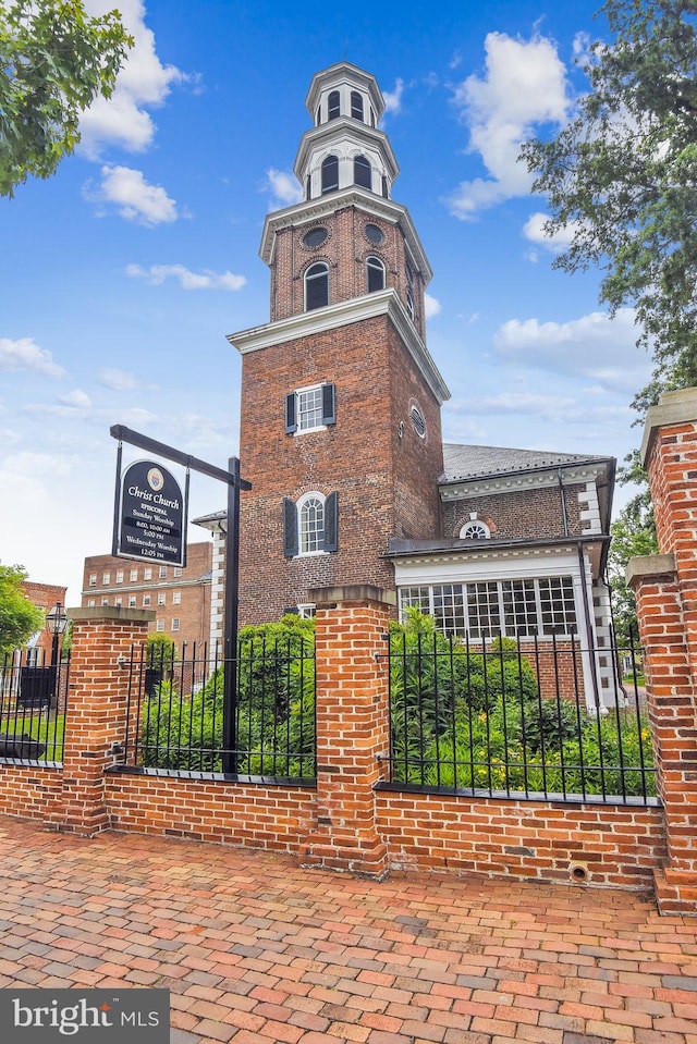 view of building exterior featuring a fenced front yard