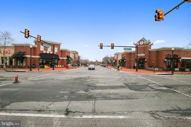 view of street with traffic lights and traffic signs