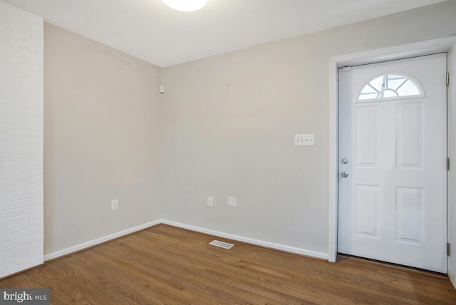 foyer with dark hardwood / wood-style floors