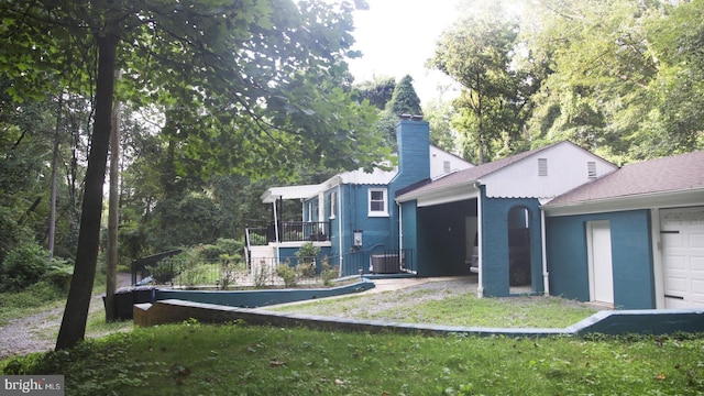 rear view of house featuring a yard