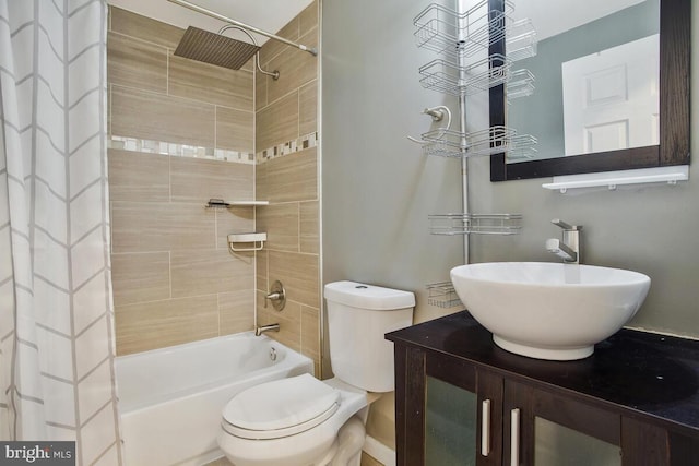 full bathroom with shower / bath combo with shower curtain, vanity, and toilet