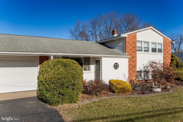 view of side of home featuring a garage