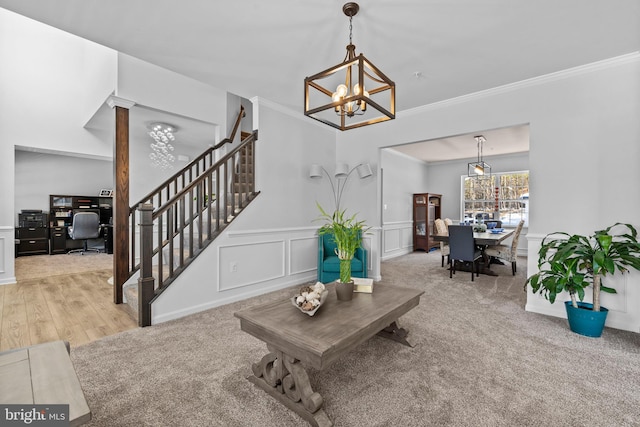 living room featuring light carpet, crown molding, and a notable chandelier