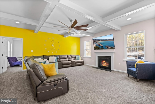 carpeted living room with ceiling fan, beam ceiling, and coffered ceiling