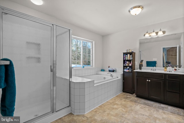 bathroom with shower with separate bathtub and vanity