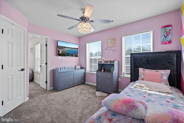 carpeted bedroom with ceiling fan