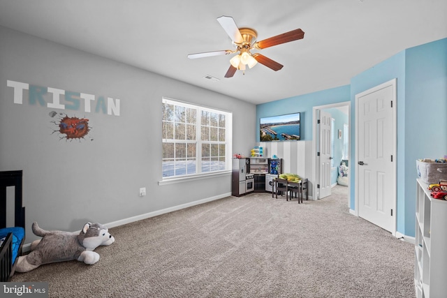 interior space with ceiling fan