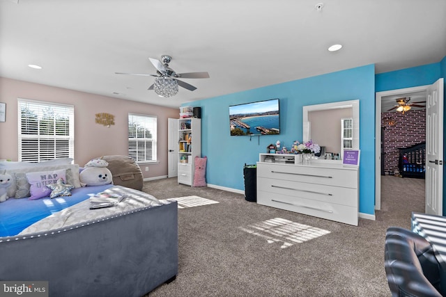 bedroom featuring ceiling fan and dark carpet