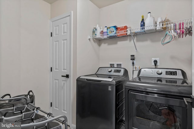 laundry room with separate washer and dryer