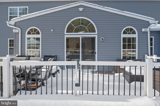 view of snow covered deck