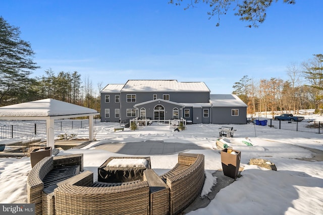 snow covered house with a gazebo