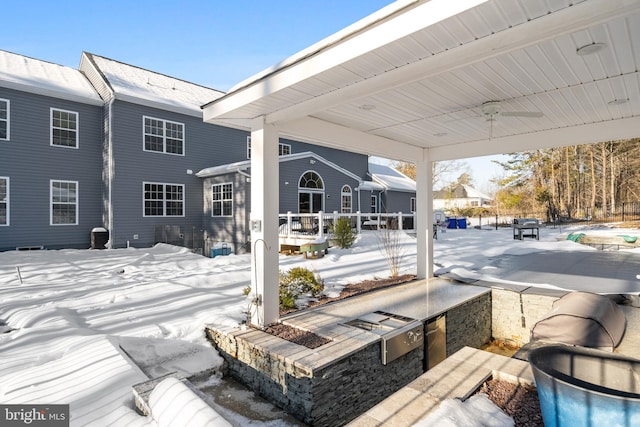 view of snow covered patio