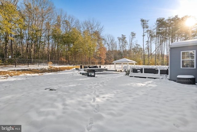 yard layered in snow featuring a gazebo