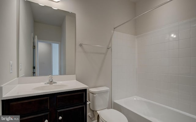 full bathroom featuring shower / bathing tub combination, vanity, and toilet