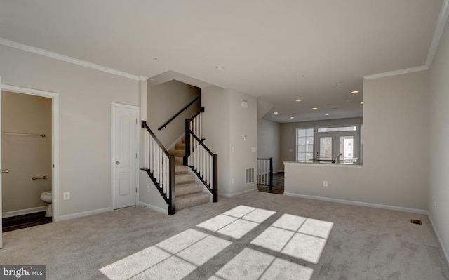 carpeted empty room with crown molding