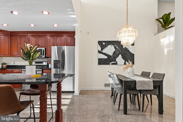 dining area featuring a chandelier