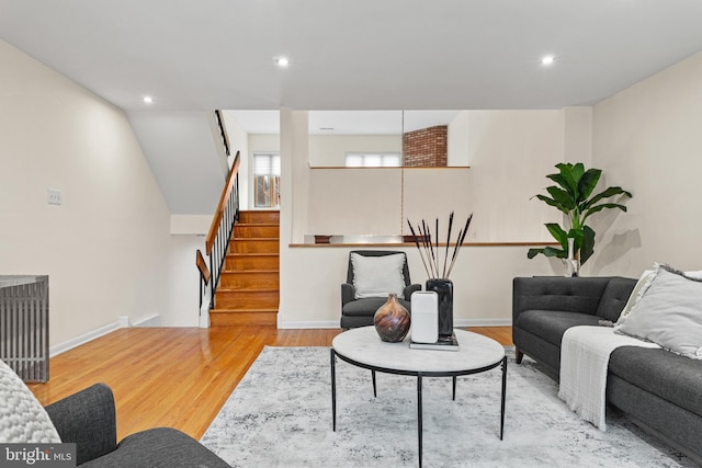 living room with light hardwood / wood-style flooring