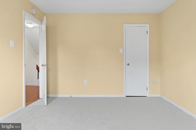 unfurnished bedroom with light colored carpet