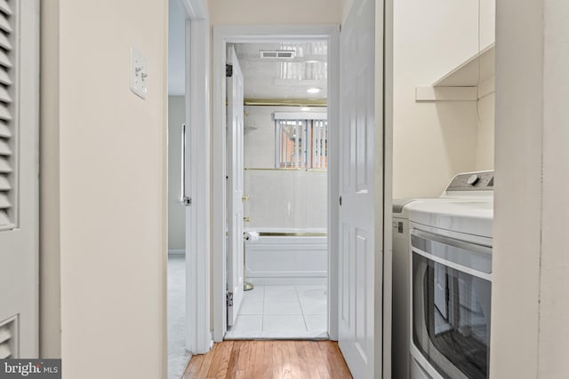 washroom with light hardwood / wood-style flooring