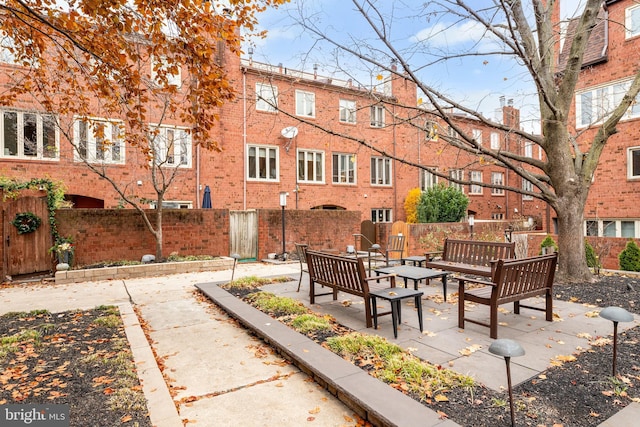 view of property's community featuring an outdoor living space