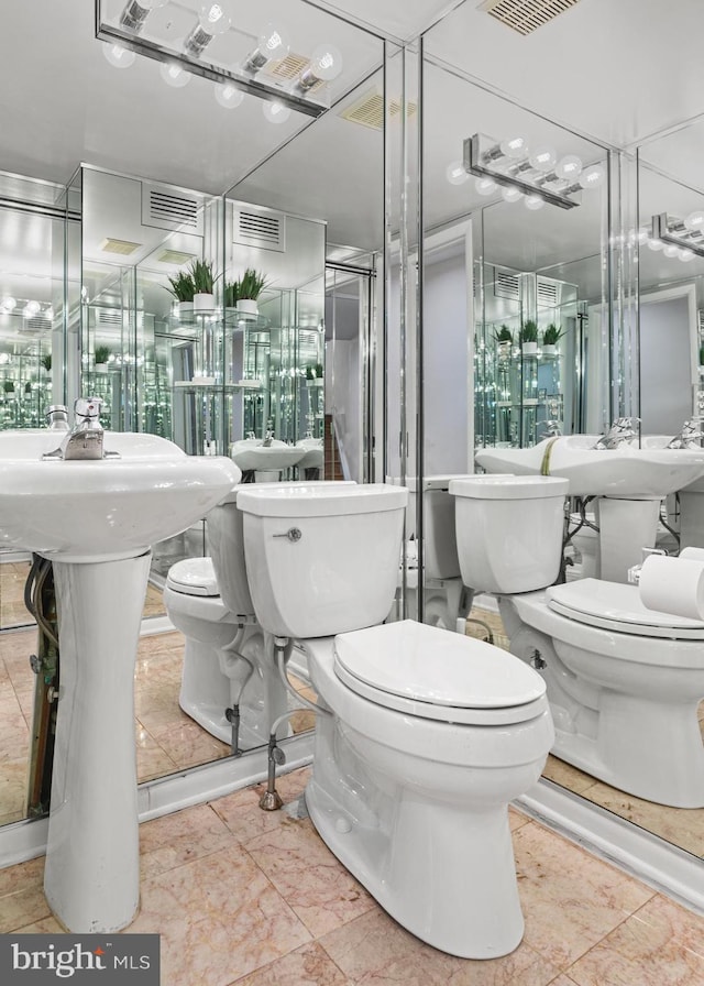 bathroom with tile patterned flooring and toilet