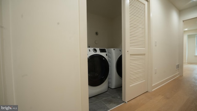 clothes washing area featuring washing machine and dryer