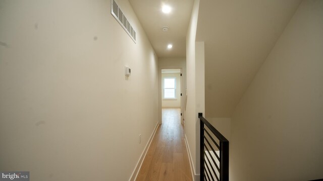 corridor featuring light hardwood / wood-style floors