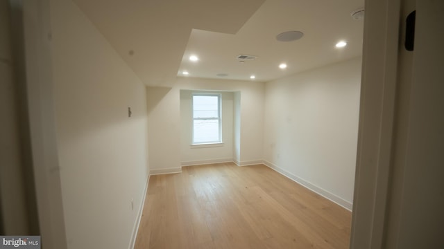 additional living space featuring light hardwood / wood-style floors