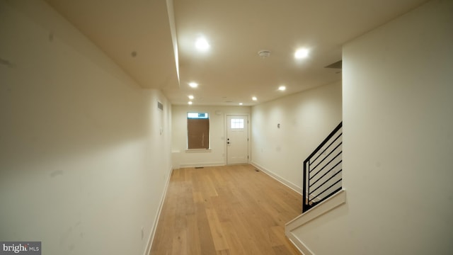 hall with light hardwood / wood-style floors