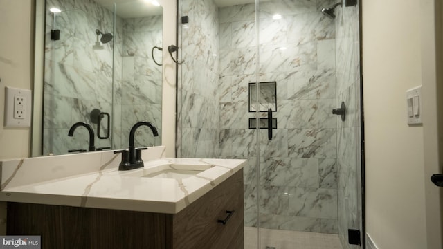 bathroom with vanity and an enclosed shower