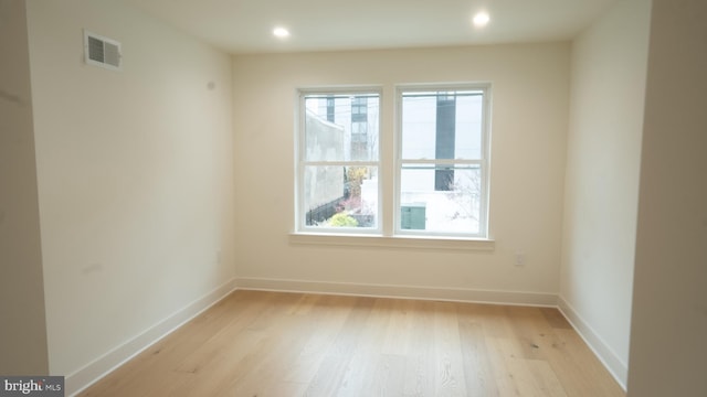 unfurnished room featuring light hardwood / wood-style flooring