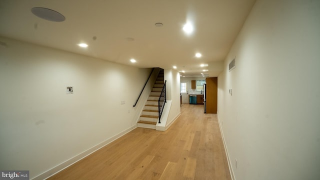 hallway with light wood-type flooring