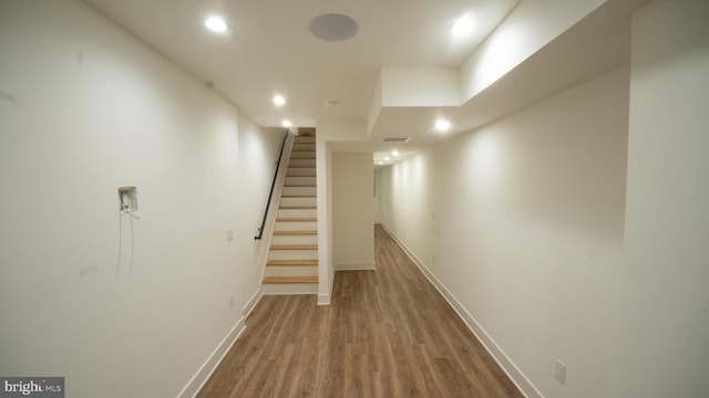 hallway featuring wood-type flooring