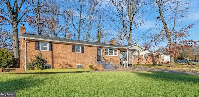 back of house with a lawn