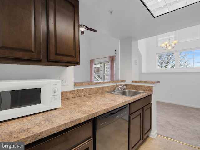 kitchen featuring light carpet, ceiling fan with notable chandelier, sink, black dishwasher, and dark brown cabinets